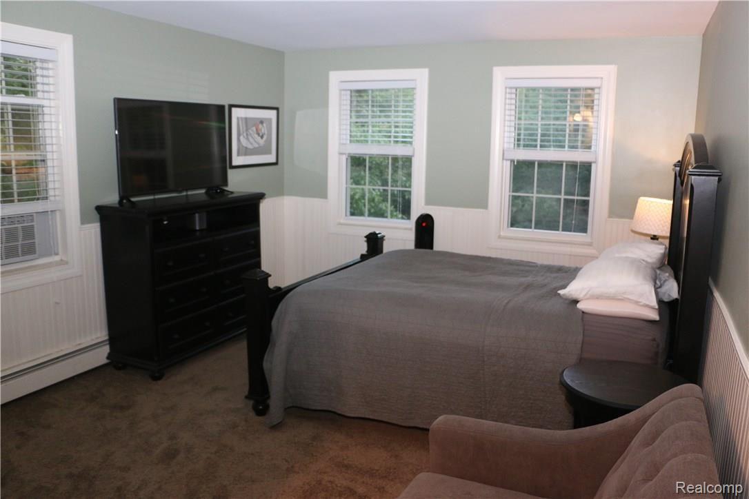 9404 Mabley Hill Road Fenton, MI 48430 - Photo 31 of 46 Master Bedroom, those two windows face the backyard to the south, the window on the left overlooks the pond (and sunrise) to the east.