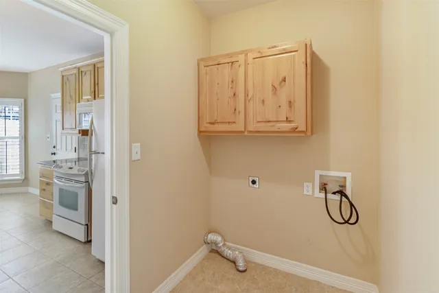 a bathroom with a granite countertop shower a sink and a stove