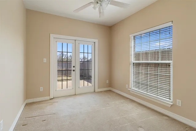 a view of an empty room with a window