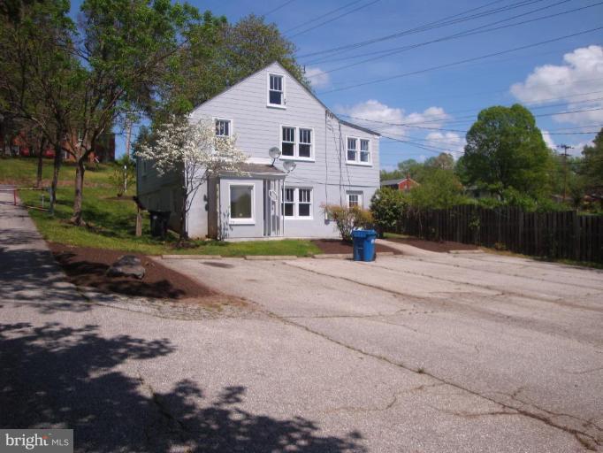 2409 Cool Spring Road Adelphi, MD 20783 - Photo 14 of 24 a front view of a house with a yard