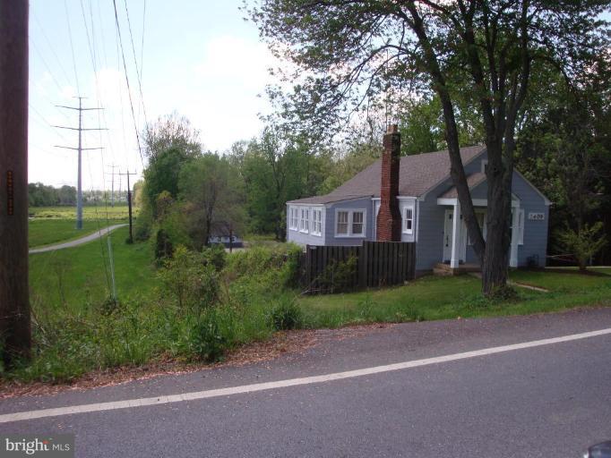 2409 Cool Spring Road Adelphi, MD 20783 - Photo 18 of 24 a front view of a house with garden