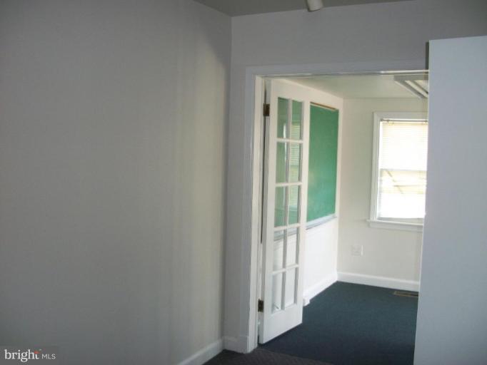2409 Cool Spring Road Adelphi, MD 20783 - Photo 24 of 24 an entryway of a room with wooden floor and windows