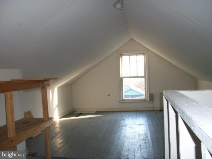 2409 Cool Spring Road Adelphi, MD 20783 - Photo 7 of 24 an empty room with wooden floor and windows