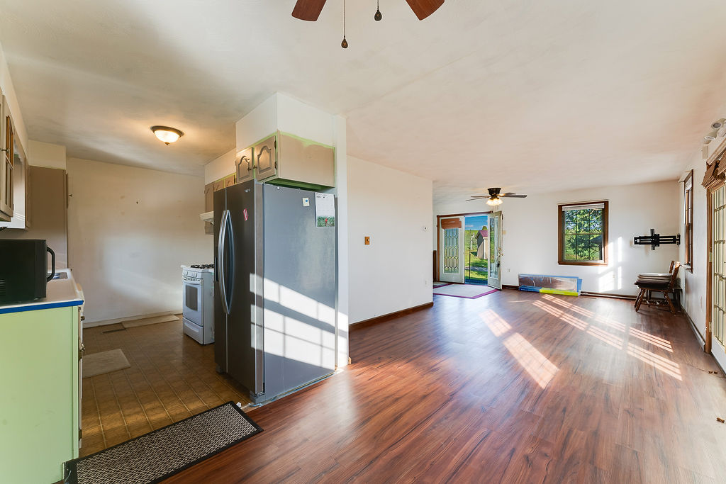 100 Nichols Ridge Road Seaman, OH 45679 - Photo 16 of 43 This versatile space seamlessly connects the kitchen and living areas, offering abundant natural light.