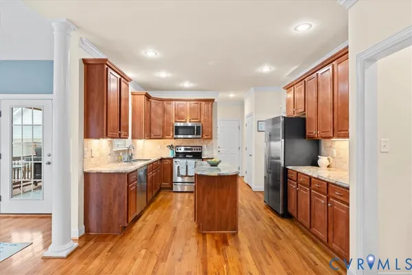 a balcony with furniture and a potted plant