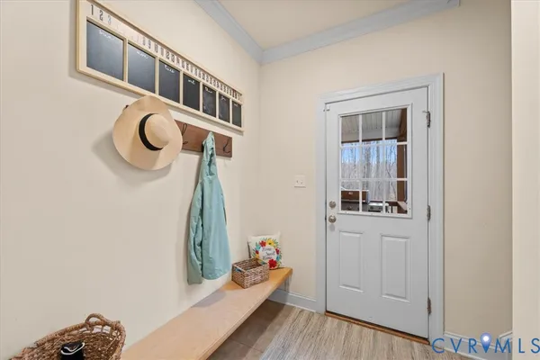 a view of a hallway with wooden floor