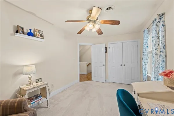 a view of entryway and hall with a front door