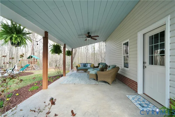 a view of a dining room with furniture window and outside view