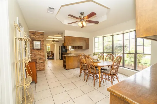 a view of a dining room with furniture window and outside view