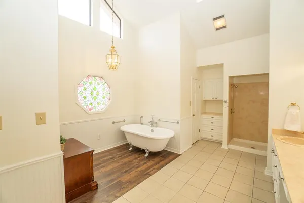 a bathroom with a sink mirror and toilet