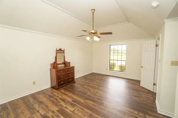 a view of a livingroom with a hardwood floor and a ceiling fan