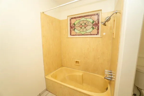 a bath tub sitting next to a blue wall