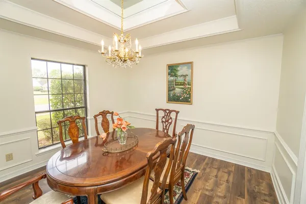 a dining room with furniture and window