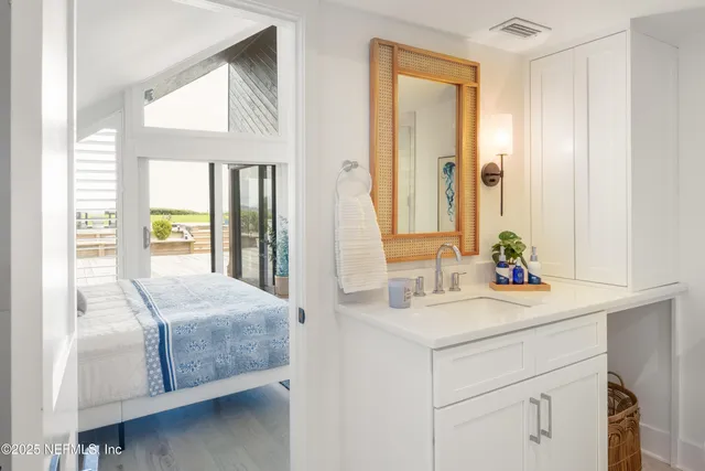 a bedroom with a bed and a dresser