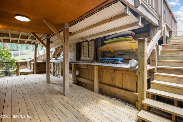 a view of a living room with wooden floor