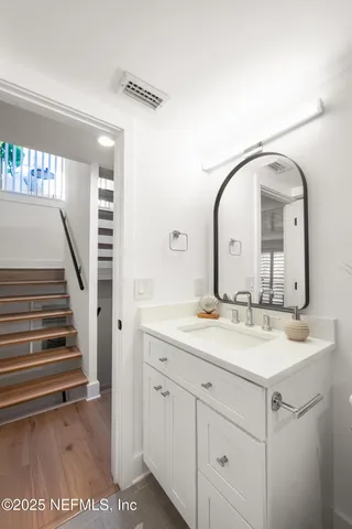 a bathroom with a sink and a mirror