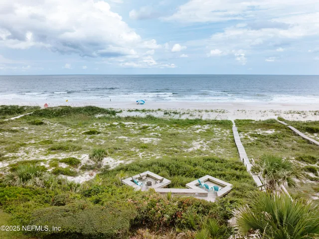 a view of a house with pool and chairs
