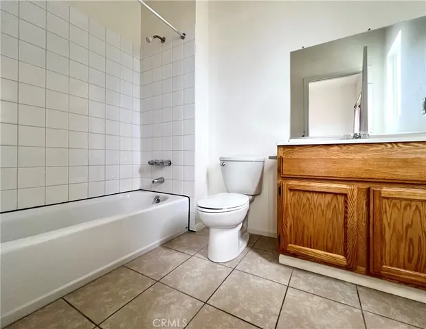 a view of a livingroom with a ceiling fan and window