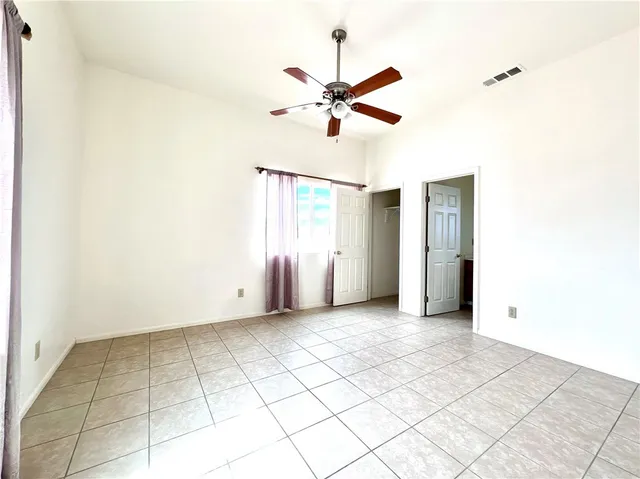 a bathroom with a granite countertop toilet a sink and bathtub