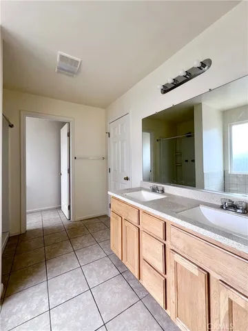 a kitchen with a stove a refrigerator and a sink