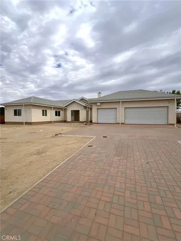 a view of house with yard and entertaining space