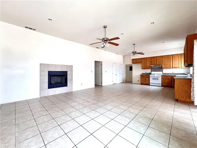 a view of a kitchen with a sink and a refrigerator