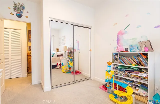 a view of play room with toys and air hockey table