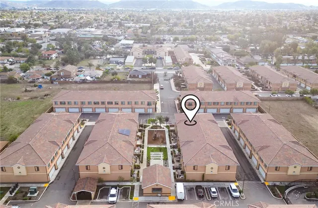 an aerial view of residential houses with outdoor space