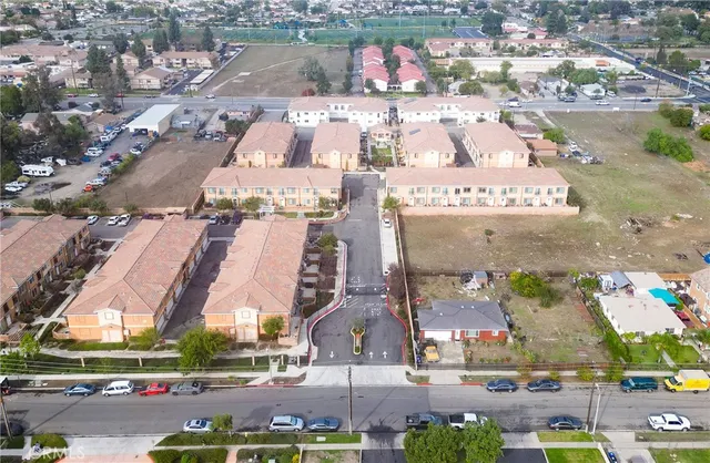 an aerial view of residential houses with outdoor space