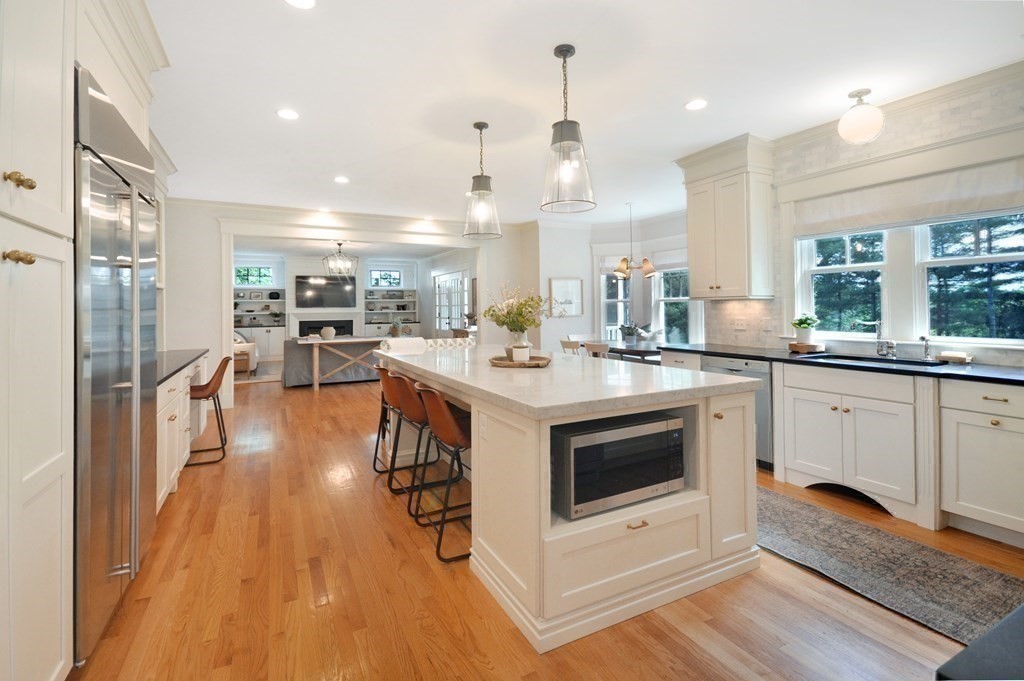 127 Revolutionary Road Concord, MA 01742 - Photo 7 of 27 a kitchen with a sink stainless steel appliances and cabinets