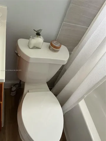 a bathroom with a toilet and sink