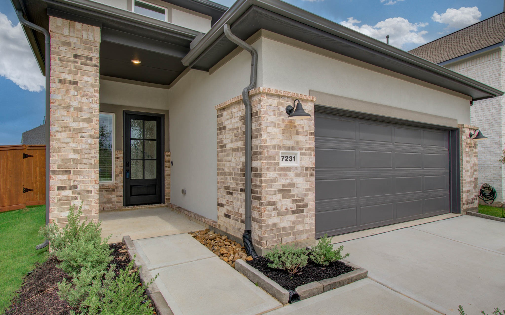 7231 Yarrow Blossom Court Katy, TX 77493 - Photo 9 of 49 a front view of a house with a garden