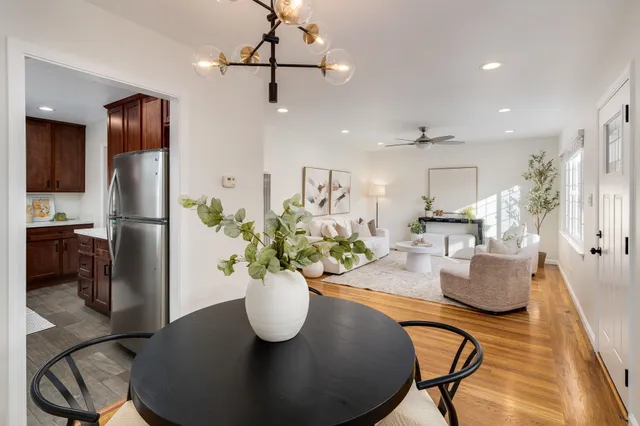 a dining room with furniture and chandelier