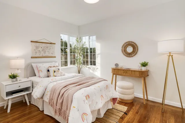 a bedroom with a bed and a table