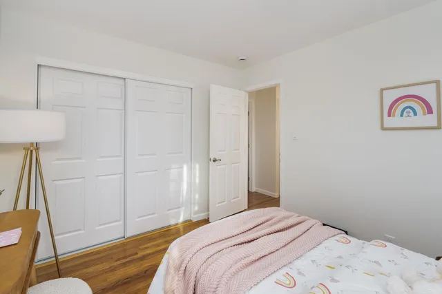 a bedroom with a bed and a couch