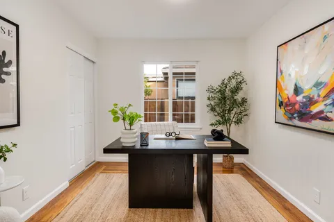 a dining room with a table and chairs