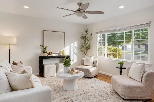 a living room with furniture and a large window