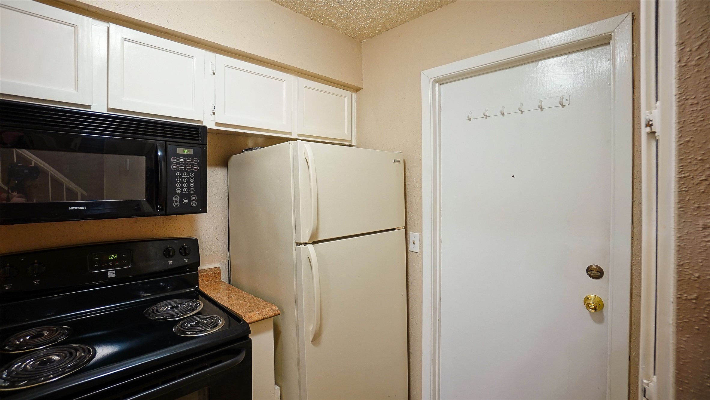 2277 South Kirkwood Road, Unit 507 Houston, TX 77077 - Photo 14 of 34 Garage entry is in kitchen area for easy grocery unloading