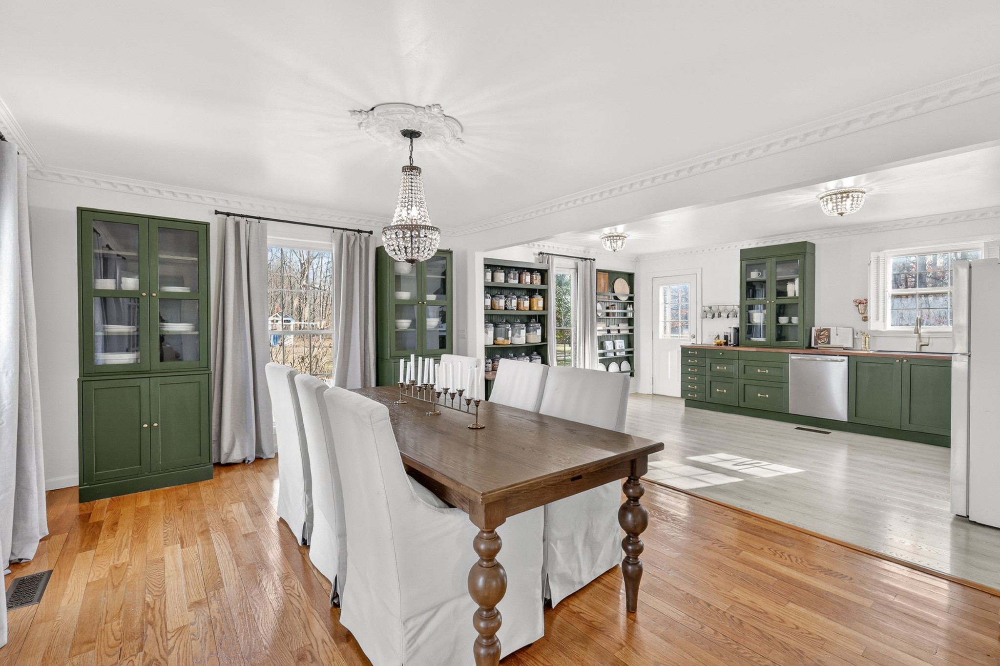 175 Dry Weakley Road Ethridge, TN 38456 - Photo 14 of 49 a open kitchen with stainless steel appliances granite countertop a refrigerator a stove a sink dishwasher and white cabinets with wooden floor