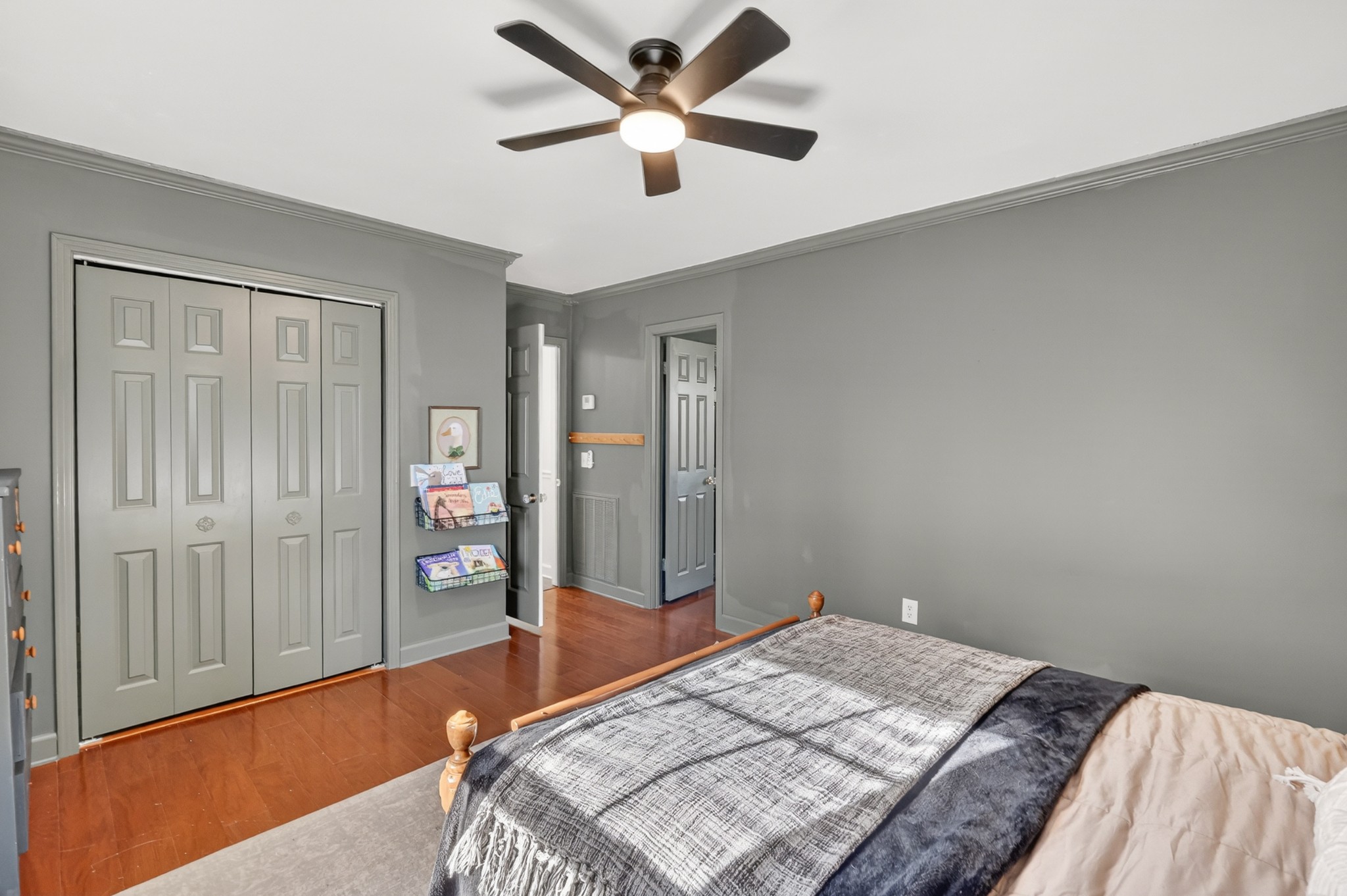 175 Dry Weakley Road Ethridge, TN 38456 - Photo 31 of 49 a bedroom with a bed and a chandelier