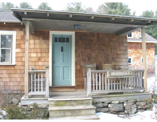188 Sugar Road Bolton, MA 01740 - Photo 3 of 23 a front view of a house with a porch