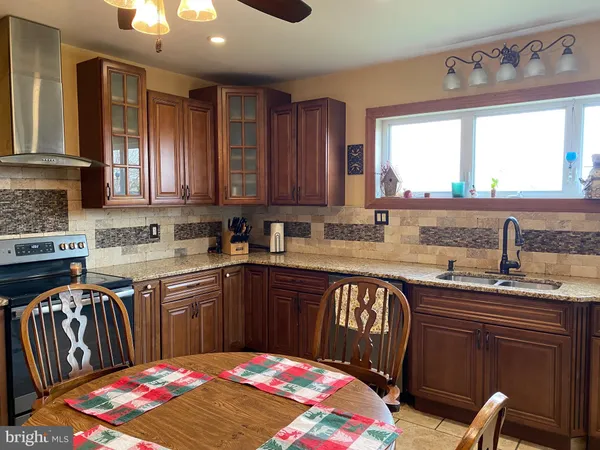 a kitchen with a sink cabinets and window