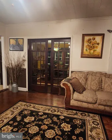 a living room with furniture and a rug
