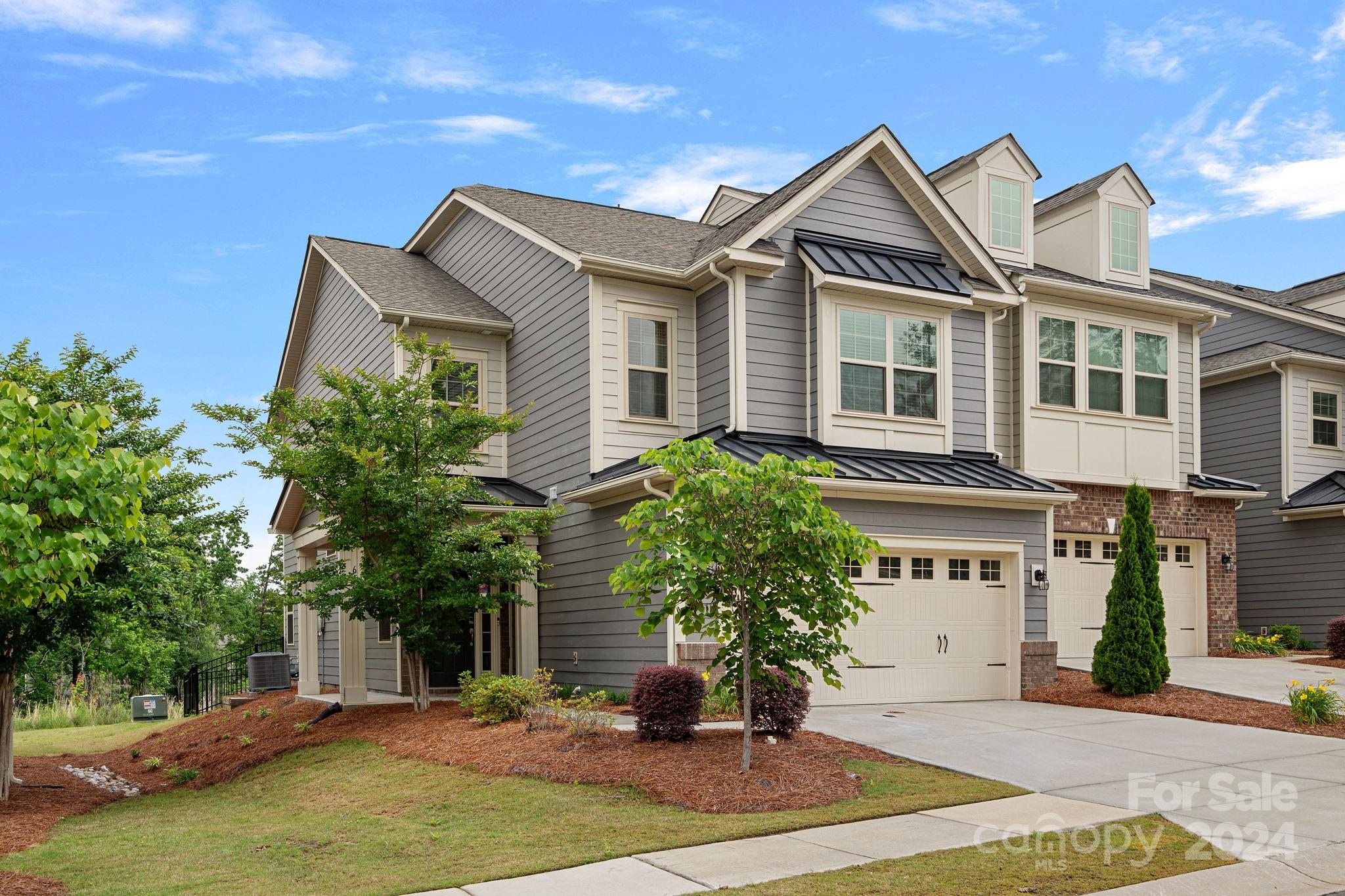 612 Amber Meadows Way Fort Mill, SC 29708 - Photo 1 of 34 a front view of a house with a yard