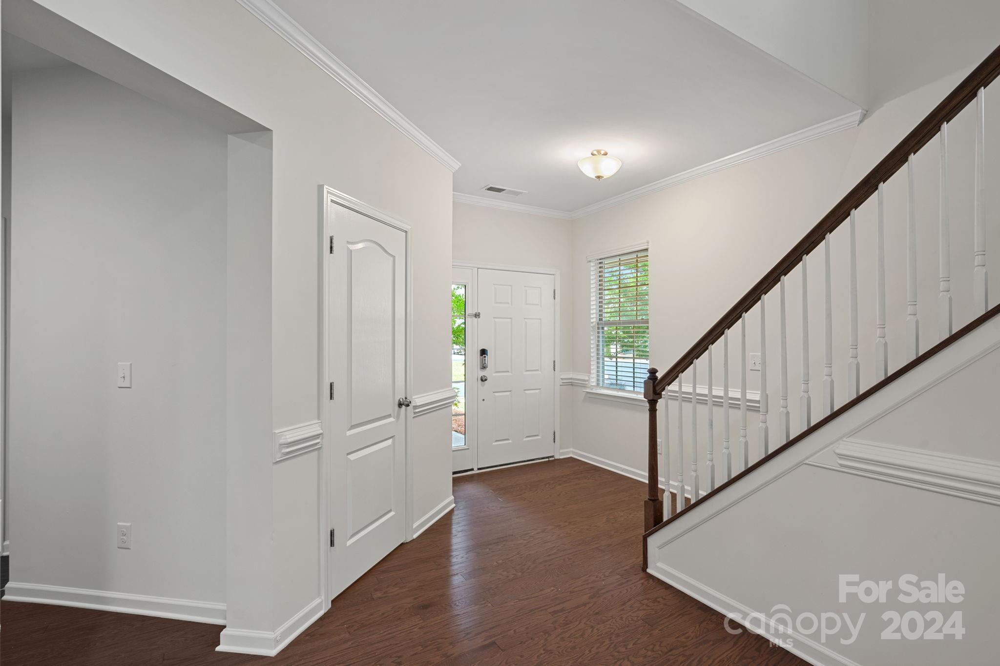 612 Amber Meadows Way Fort Mill, SC 29708 - Photo 19 of 34 a view of entryway with wooden floor and stair