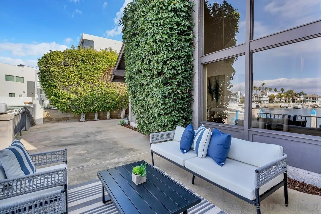 29 Green Turtle Road Coronado, CA 92118 - Photo 11 of 68 a view of patio with a table and chairs and potted plants