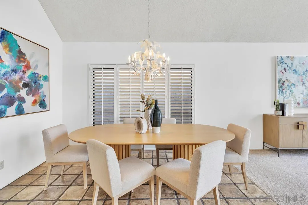29 Green Turtle Road Coronado, CA 92118 - Photo 23 of 68 a view of a dining room with furniture a chandelier and wooden floor