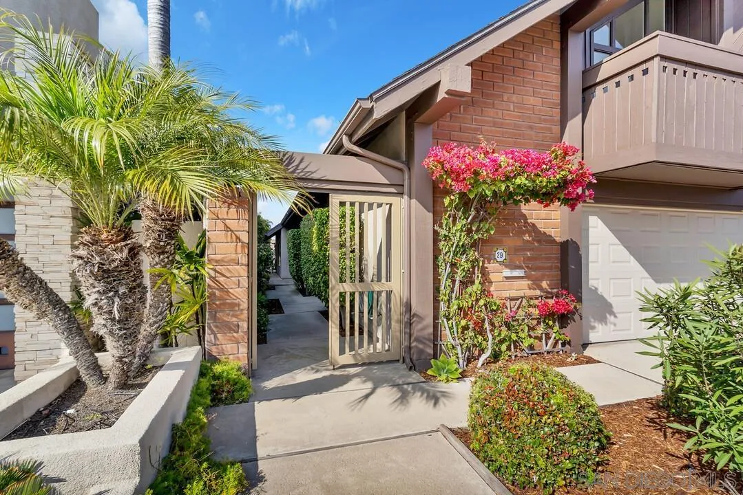 29 Green Turtle Road Coronado, CA 92118 - Photo 3 of 68 a front view of a house with a yard