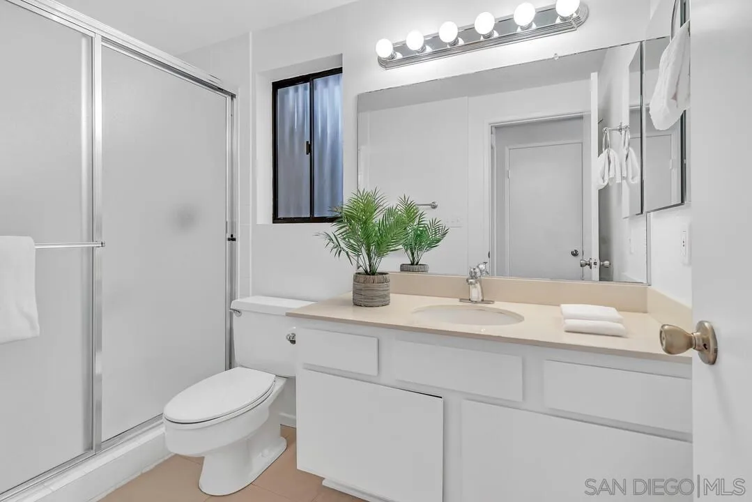29 Green Turtle Road Coronado, CA 92118 - Photo 38 of 68 a bathroom with a sink a toilet and shower