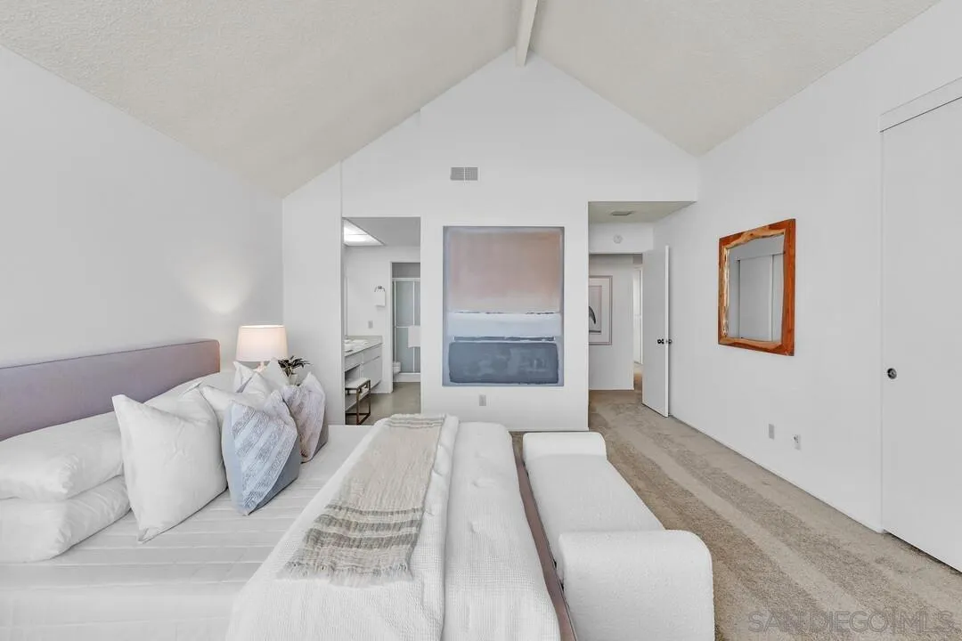 29 Green Turtle Road Coronado, CA 92118 - Photo 40 of 68 a bed room with a bed and a large mirror